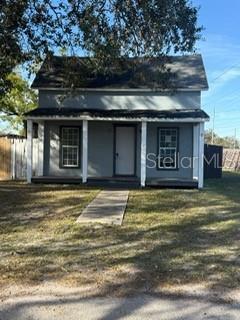 view of outbuilding featuring a lawn