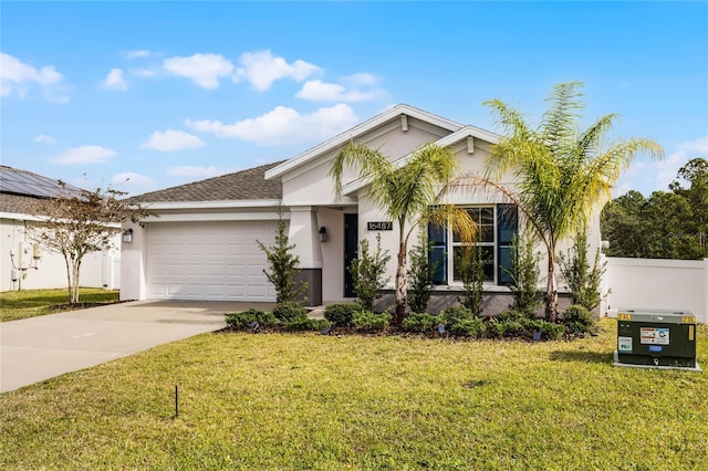 view of front of house with a garage and a front yard