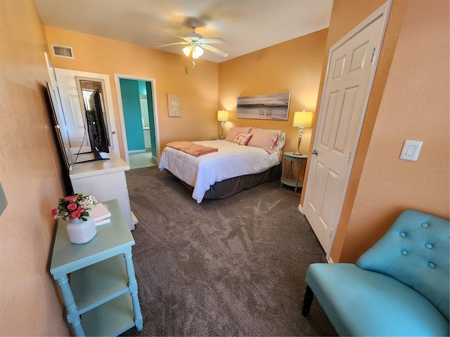 carpeted bedroom featuring connected bathroom and ceiling fan