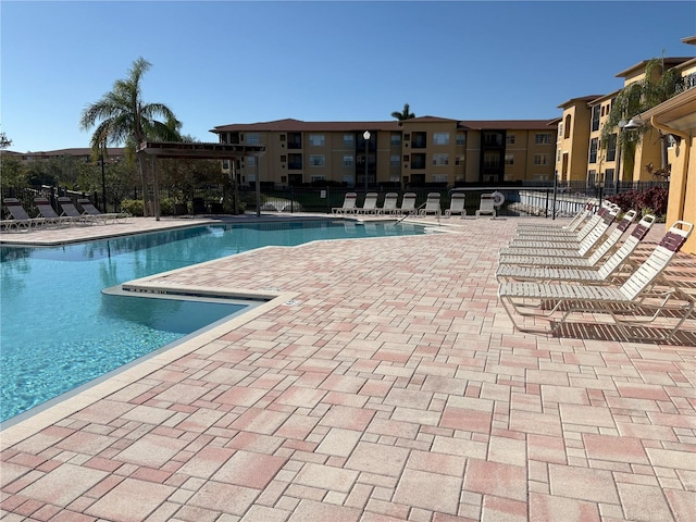 view of swimming pool featuring a patio area