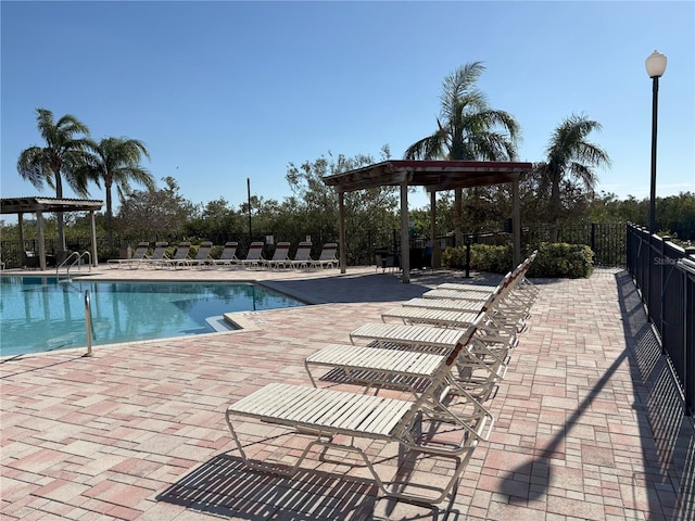 view of swimming pool with a patio area