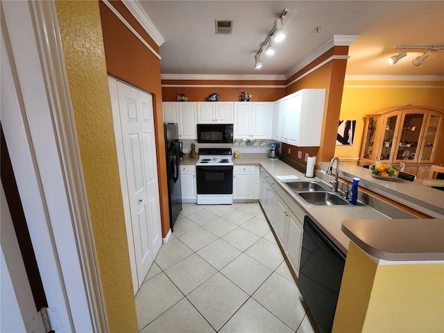 kitchen featuring visible vents, black appliances, ornamental molding, a sink, and light tile patterned floors