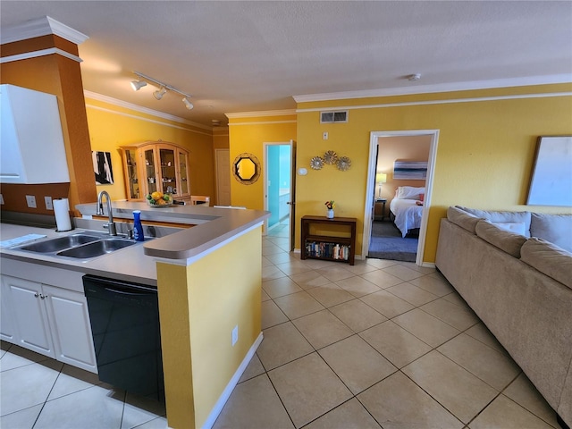 kitchen featuring dishwasher, visible vents, open floor plan, and ornamental molding