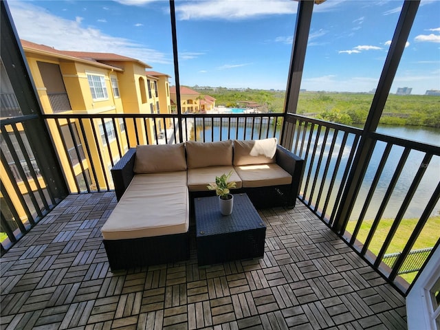 balcony featuring an outdoor hangout area and a water view