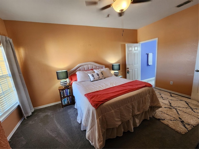 carpeted bedroom with visible vents, ceiling fan, and baseboards