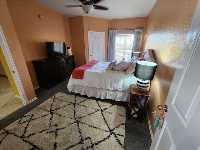 bedroom with baseboards and a ceiling fan