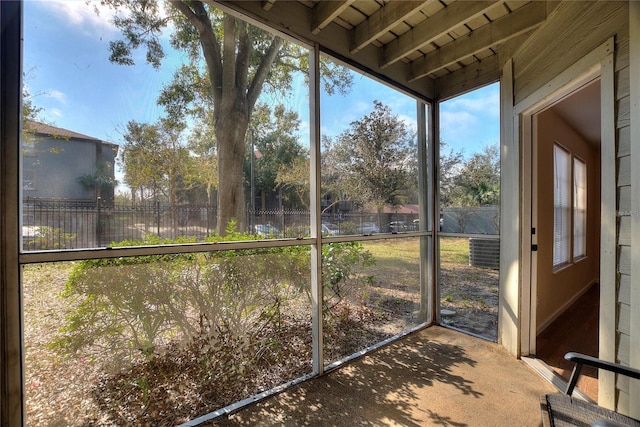 unfurnished sunroom featuring plenty of natural light