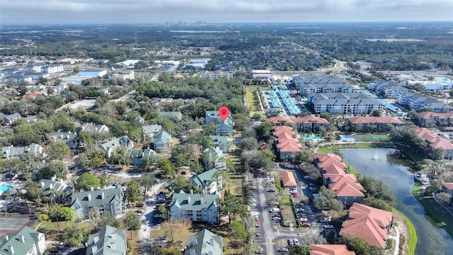 birds eye view of property featuring a water view