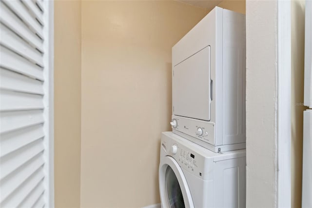 laundry room with stacked washer and dryer