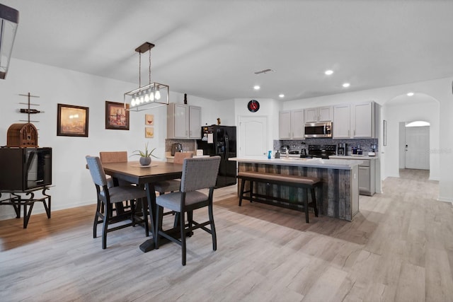 dining space with light wood-type flooring