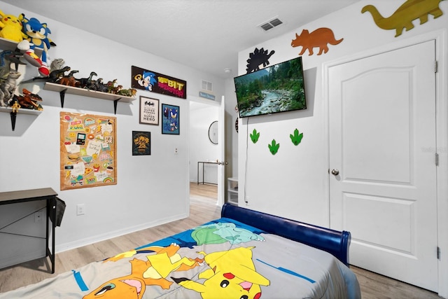 bedroom featuring light wood-type flooring