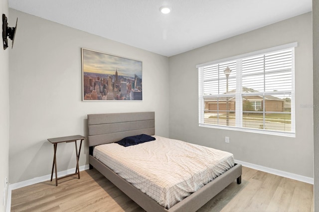 bedroom with light hardwood / wood-style flooring