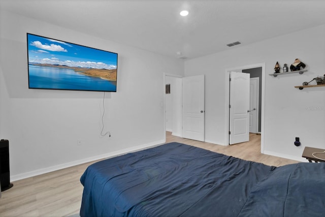 bedroom with light wood-type flooring