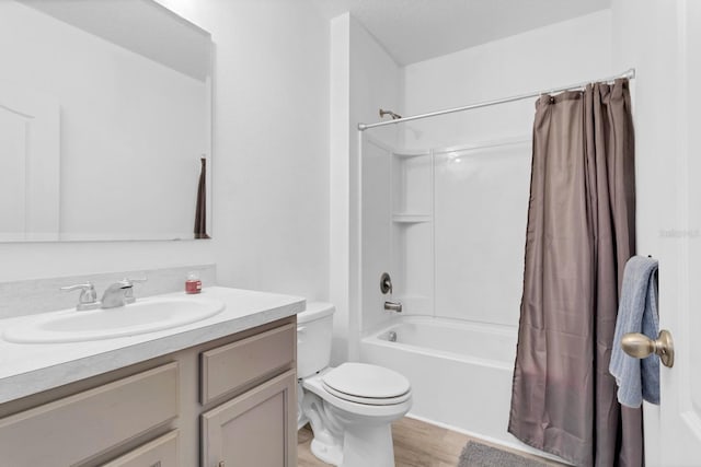 full bathroom featuring vanity, toilet, shower / tub combo, and hardwood / wood-style flooring