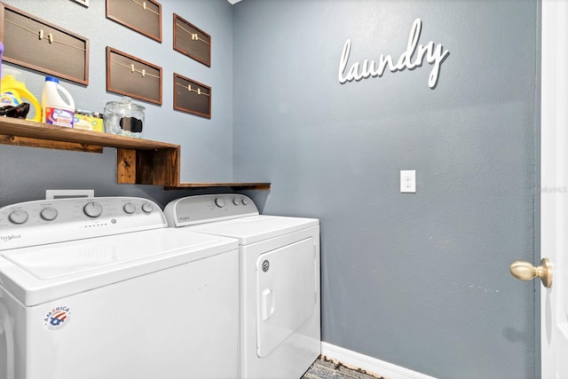 laundry area with washing machine and clothes dryer