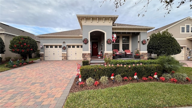 view of front of house featuring covered porch and a garage