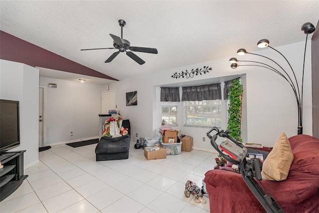 tiled living room featuring a textured ceiling, vaulted ceiling, and ceiling fan