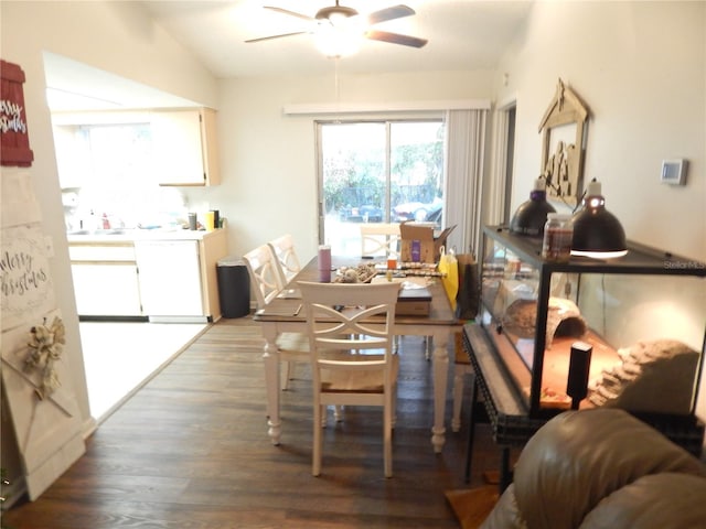 dining room with dark hardwood / wood-style floors, ceiling fan, and lofted ceiling