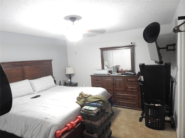 carpeted bedroom featuring a textured ceiling