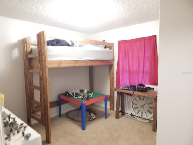 carpeted bedroom with a textured ceiling