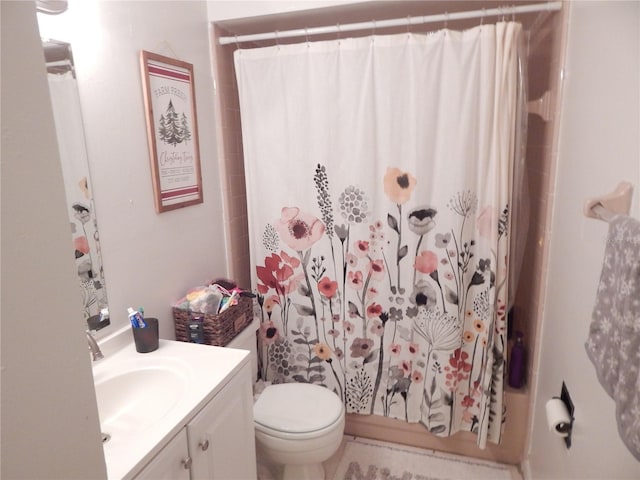 full bathroom featuring vanity, shower / bath combo, and toilet