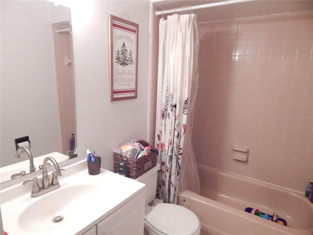 full bathroom with shower / tub combo with curtain, vanity, and toilet