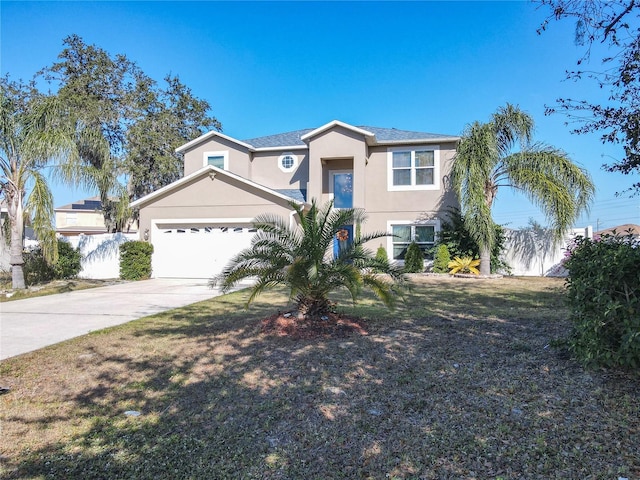 view of front of home with a garage and a front lawn