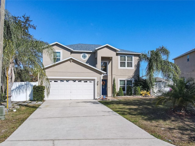 view of front of home featuring a garage and a front lawn