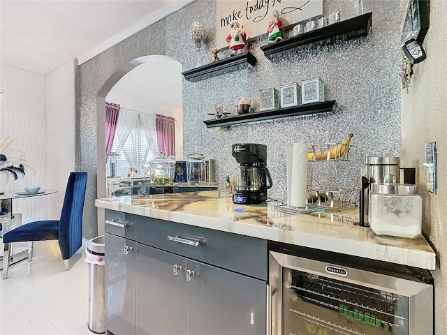 kitchen featuring backsplash and wine cooler