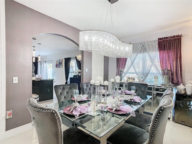 dining room featuring a chandelier and a wealth of natural light