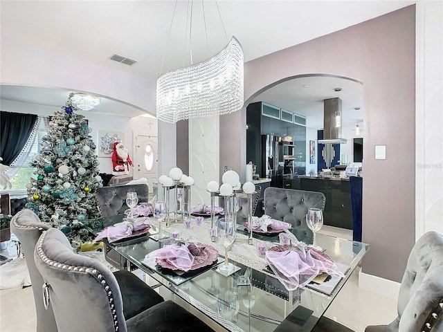 dining area featuring a notable chandelier