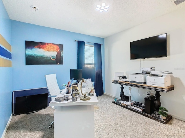 office space featuring a textured ceiling and carpet floors