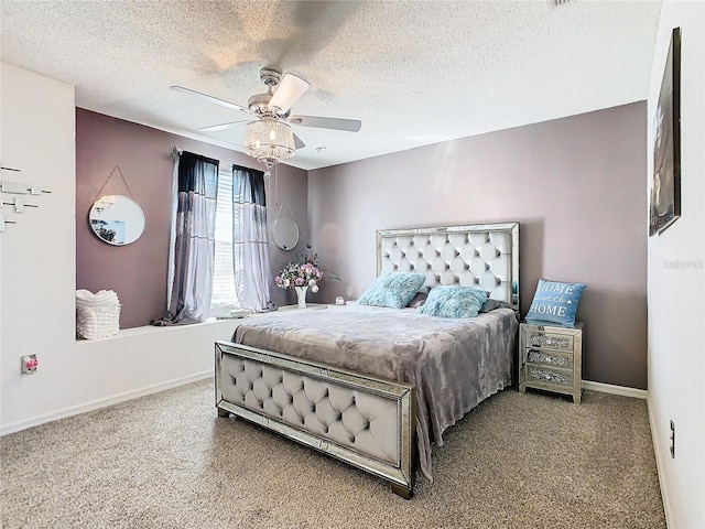 bedroom featuring ceiling fan and a textured ceiling