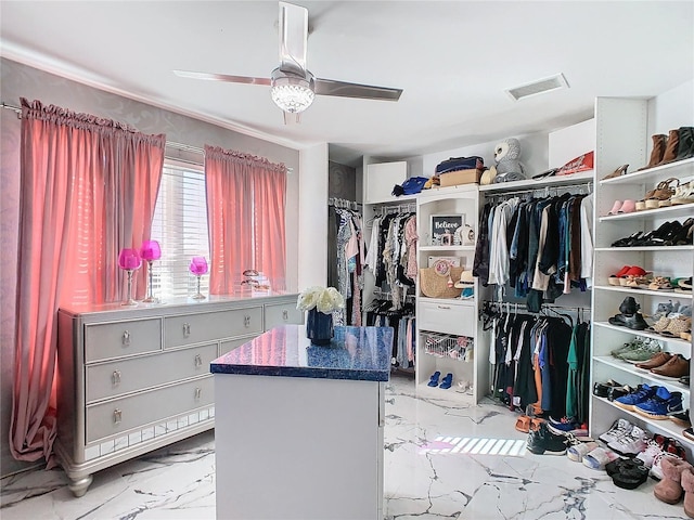 spacious closet featuring ceiling fan