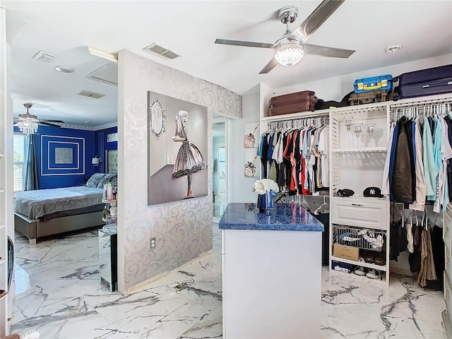 spacious closet featuring ceiling fan