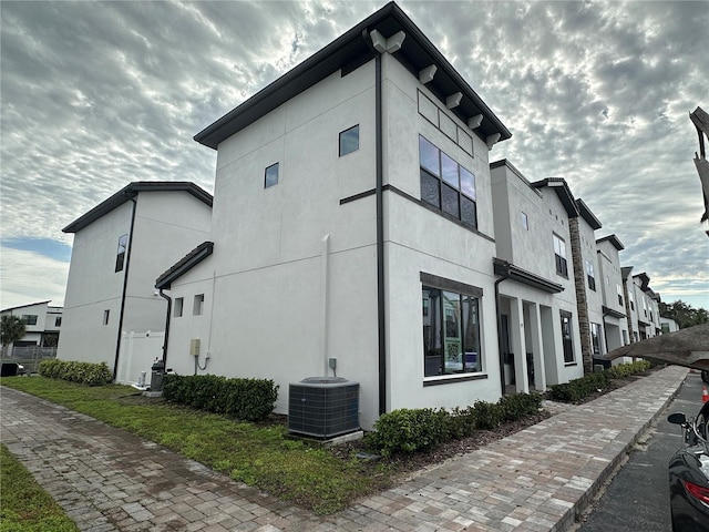 view of side of home with cooling unit