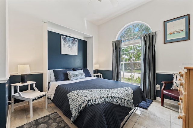 bedroom featuring ceiling fan and light tile patterned flooring