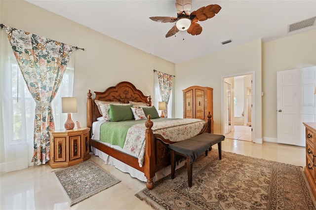 bedroom featuring ensuite bath, visible vents, ceiling fan, and baseboards