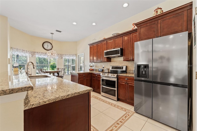 kitchen featuring light tile patterned floors, stainless steel appliances, recessed lighting, backsplash, and a sink