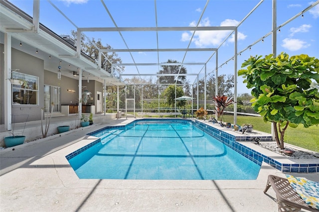 pool featuring a lanai, a patio, and ceiling fan