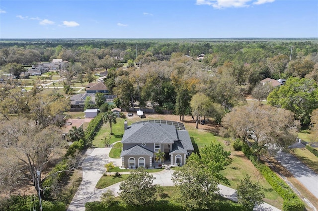 bird's eye view featuring a wooded view