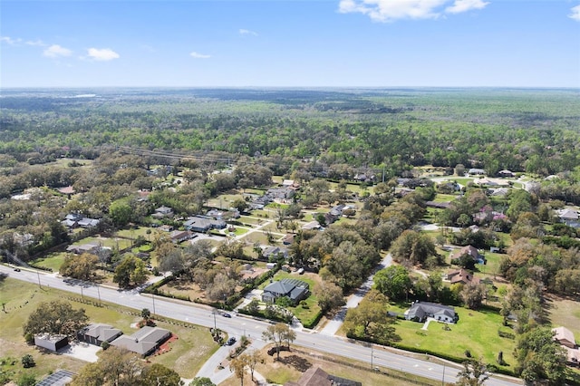 bird's eye view featuring a wooded view