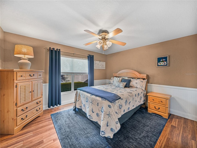 bedroom featuring ceiling fan and light wood-type flooring