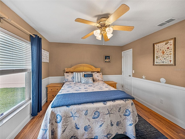 bedroom with ceiling fan and wood-type flooring