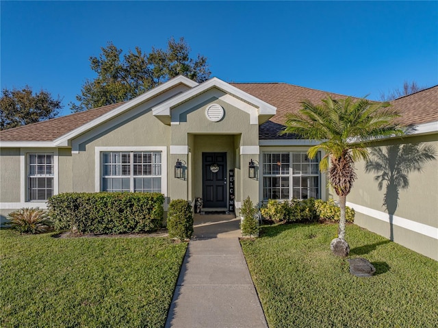 ranch-style house featuring a front lawn