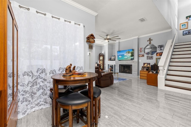 dining room featuring ceiling fan and ornamental molding