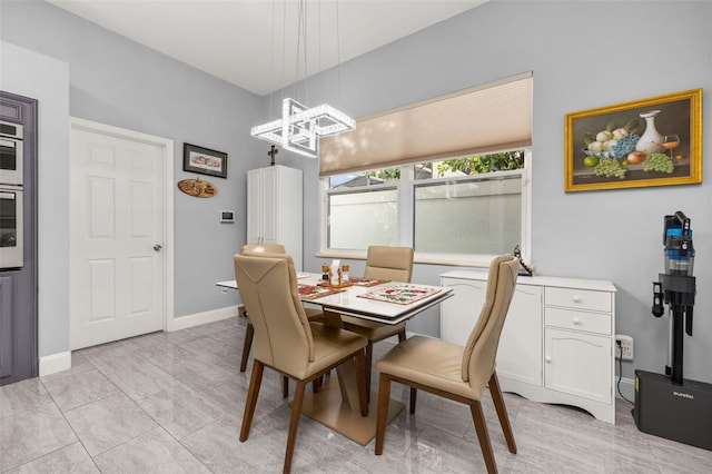 dining room featuring a chandelier