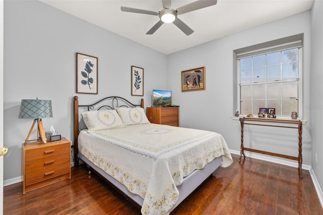 bedroom with ceiling fan and dark hardwood / wood-style floors