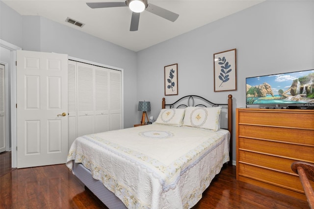 bedroom with dark hardwood / wood-style flooring, a closet, and ceiling fan