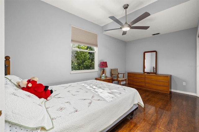 bedroom with ceiling fan and dark wood-type flooring